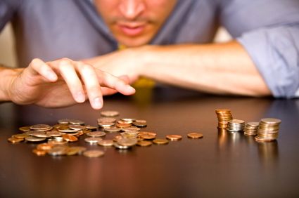 man counting pennies